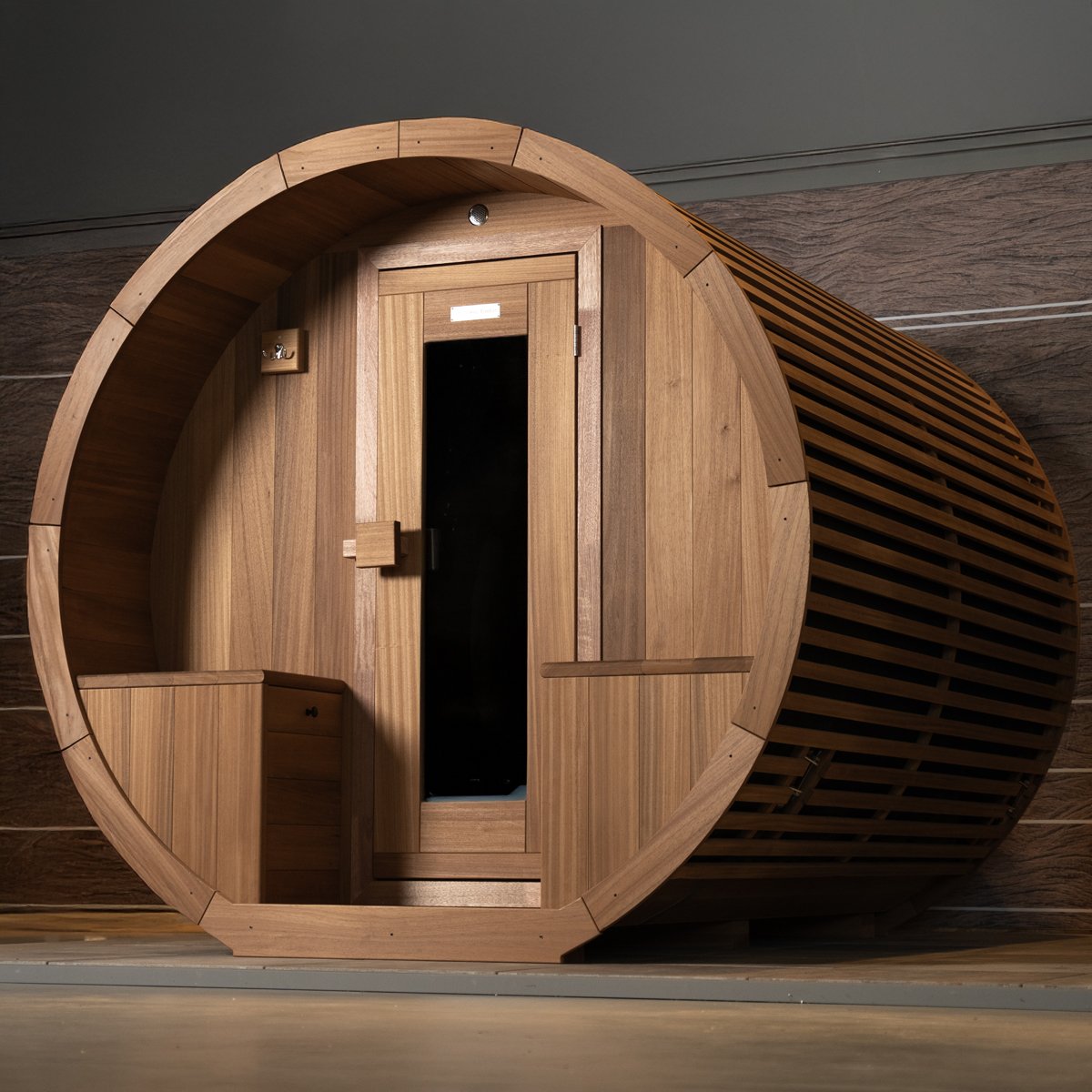 Modern barrel sauna from Happy Timber, made from sustainable Thermo Ayous wood.